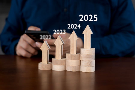 Businessman using smartphone pointing at increasing arrow graph, future business goals of company in...