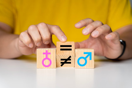 Concept of gender equality. A hand changes an unequal sign to an equal sign between male and female symbols.の写真素材