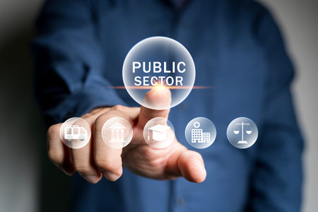 Public sector concept. government, education, health, municipal service, provide people infrastructure. Person hold public sector icon on virtual screen.の写真素材