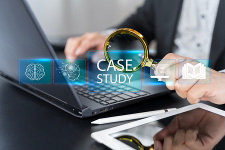 Case study education concept. Businessman use laptop with virtual case study icon for analysis of the situation to find a solution. Case study text under magnifying glass.の写真素材