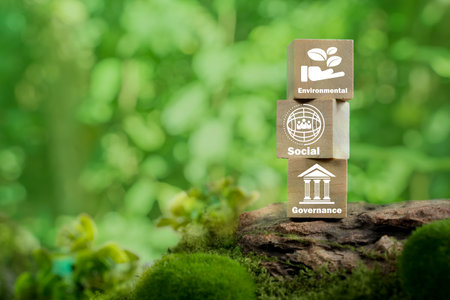 ESG concept of environmental, social and governance. Sustainable corporation development. Wooden cubes with target setting  to ESG icon with other ESG icons on bright background. Copy space.の写真素材
