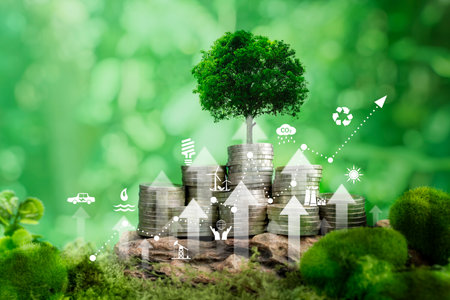 Green business growth or green investment and Finance sustainable development concept. Stack of silver coins the seedlings are growing on top with arrow of growth. Carbon credit, ESG, co2, green tax.の写真素材