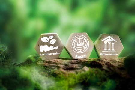 ESG concept of environmental, social and governance. Sustainable corporation development. Wooden cubes with target setting  to ESG icon with other ESG icons on bright background. Copy space.の写真素材
