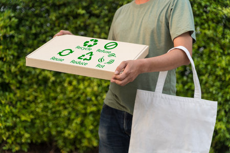 Eco vendor go green packaging parcel carton box in net zero waste store asian seller retail shop. Earth care day small SME owner asia people wrap reuse brown paper pack gift reduce plastic free order.の写真素材