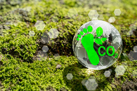 Eco-friendly and sustainable development concept with green icons representing renewable energy, clean industry, environmental protection on digital globe over green moss, nature and climate balance.の写真素材