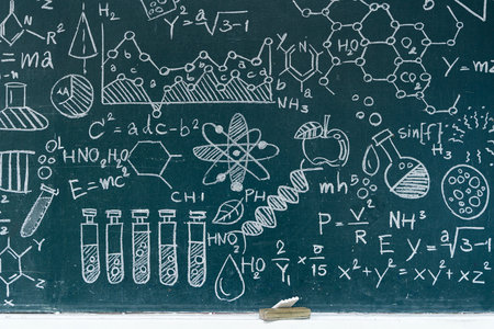 A chalkboard covered with hand-drawn scientific symbols, chemical structures, physics equations, DNA...