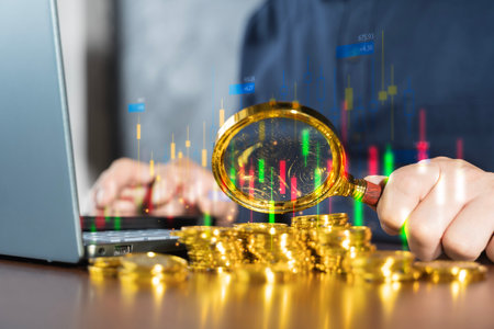 Magnifying glass focusing on stacked gold coins with candlestick chart overlay, representing financial analysis, cryptocurrency trading, wealth growth, forex investment, and digital economy strategy.の写真素材