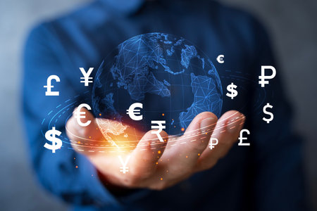 Modern concept of global finance showing multiple currency symbols around digital world map, representing international money exchange, banking, trade, and financial technology in a connected economy.の写真素材