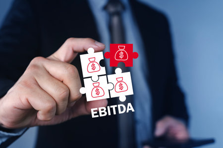 Businessman presenting EBITDA concept with money bag puzzle pieces. Corporate finance metric for...