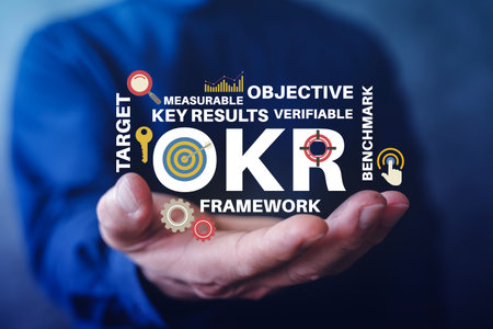 Business OKR framework concept with objective and key results text, target and KPI icons, representing goal setting, performance management, measurable metrics, benchmarking, and strategy planning.の写真素材