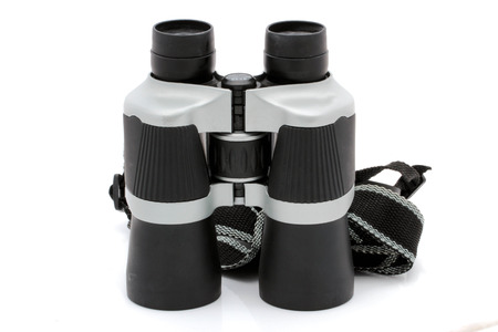 Black binoculars with orange lens isolated on white backgroundの写真素材