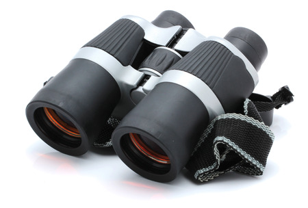 Black binoculars with orange lens isolated on white backgroundの写真素材