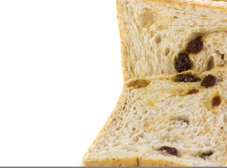 sliced raisin bread isolated on white backgroundの写真素材