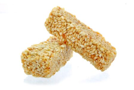 sesame seeds and honey on white backgroundの写真素材
