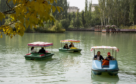 Visitors riding on a boat in the lakeのeditorial素材