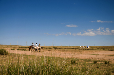 Prairie with horse ridingのeditorial素材
