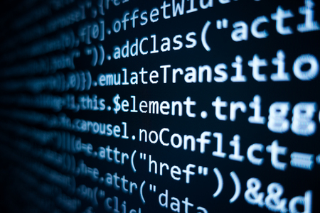 Software source code. Programming code. Programming code on computer screen. Developer working on...