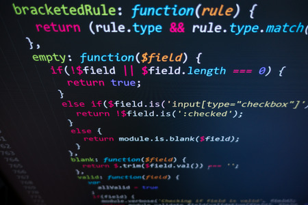 Software source code. Programming code. Programming code on computer screen. Developer working on...