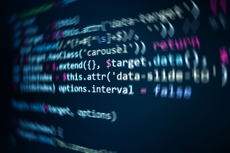 Software source code. Programming code. Programming code on computer screen. Developer working on...