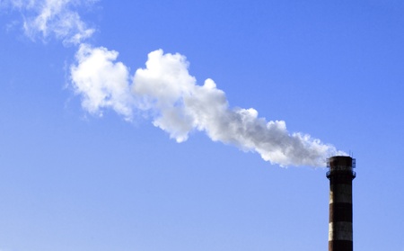 A stack and a smoke in the spring skyの写真素材