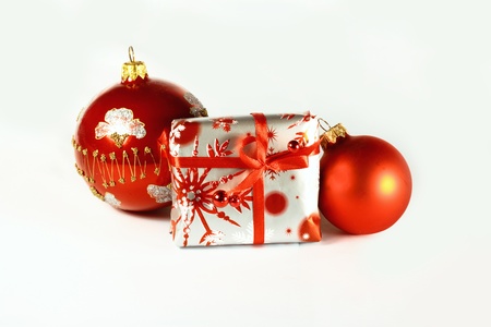 Red Christmas balls and a gift boxの写真素材