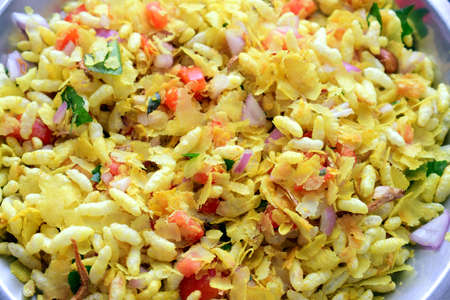 Indian tasty snacks Bhel served with chopped tomatoes,onions