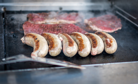 Steak and Sausages on BBQの写真素材