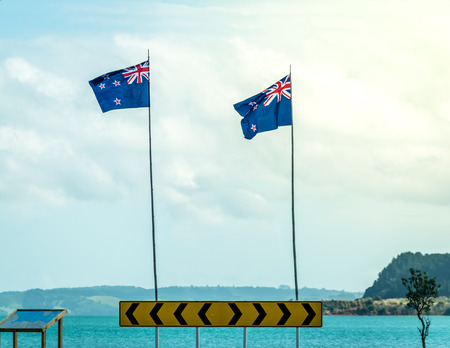 New Zealand flags by the sea sideの写真素材