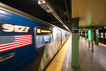 Blurred American flag on a moving train. New York City, Subway Car at Platform
