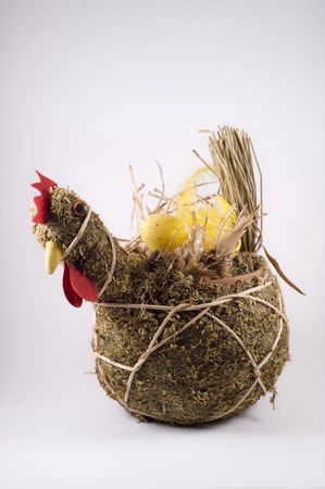 Easter decoration of a chicken with eggsの写真素材