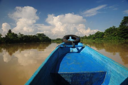 View from a blue boat on a tropical riverの写真素材