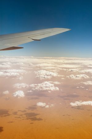Wing of airplane flying of the Sahara desertの写真素材
