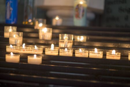 Devotional candles burning in a churchの写真素材