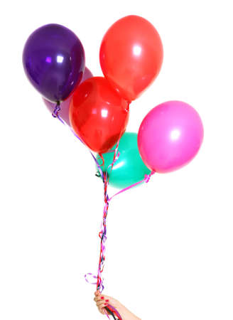 female hand with colorful balloons isolated on whiteの写真素材