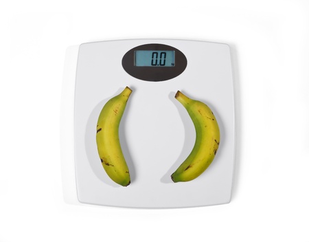 A bathroom scale with bananasの写真素材