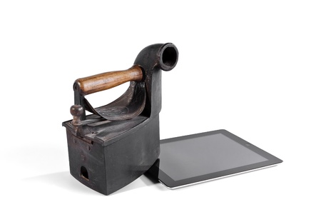 Spain - July 15, 2012: Tablet crushed with old ironのeditorial素材