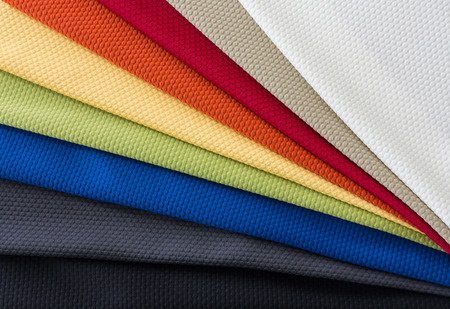 Different Multi colored fabrics for upholstered furniture, chairs, sofas, etc  in a fan