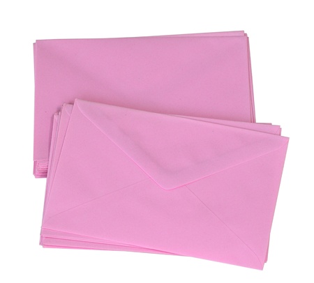 Stack of pink envelop isolated on white の写真素材