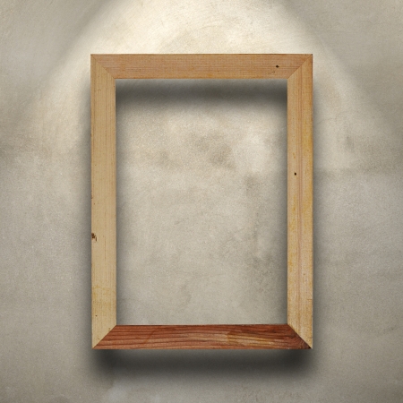 Grunge wood frame on concrete wall の写真素材