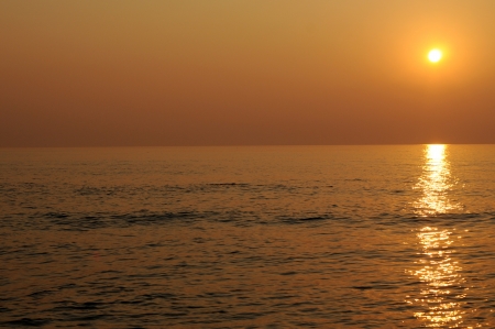 Sunrise and reflection on the sea.の写真素材