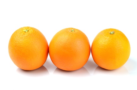 Three oranges isolated on white.の写真素材