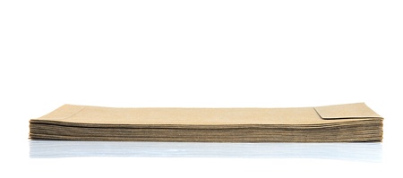 Pile of brown envelopes isolated on white.の写真素材