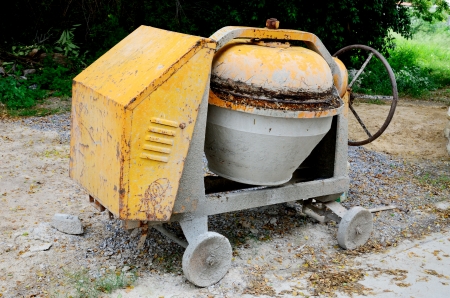 Dirty concrete mixer at constructing site.の写真素材