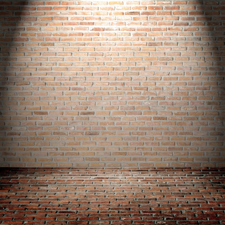 Brick wall pattern background with highlight from the top, can be used for design work or copy space or your textの写真素材