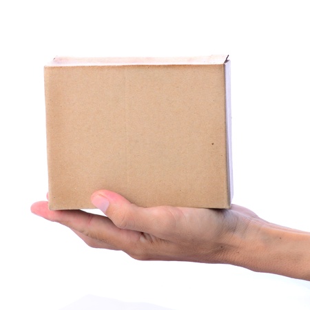Hand holding blank brown box, on white backgroundの写真素材