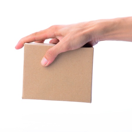 Blank brown box being picked by man's handの写真素材