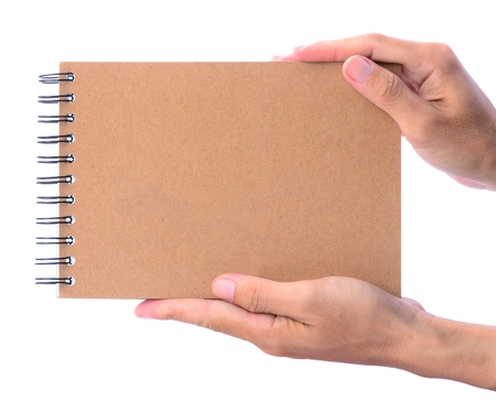 Hands presenting empty brown notebook, isolated on whiteの写真素材