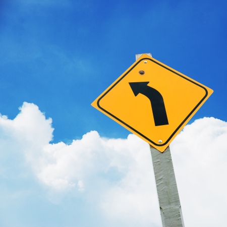 Turn left, traffice signal plate on blue sky with white cloud, view from under normal eyes' viewの写真素材