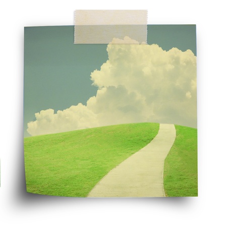 Nature background, green field and sky, on sticker paper note with scoth strip in vintage styleの写真素材