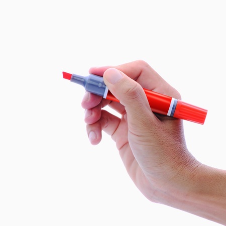 Man's hand holding red maker pen, isolated on whiteの写真素材
